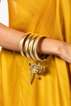 Ritika Sachdeva Golden Bangle Stack With Charms
